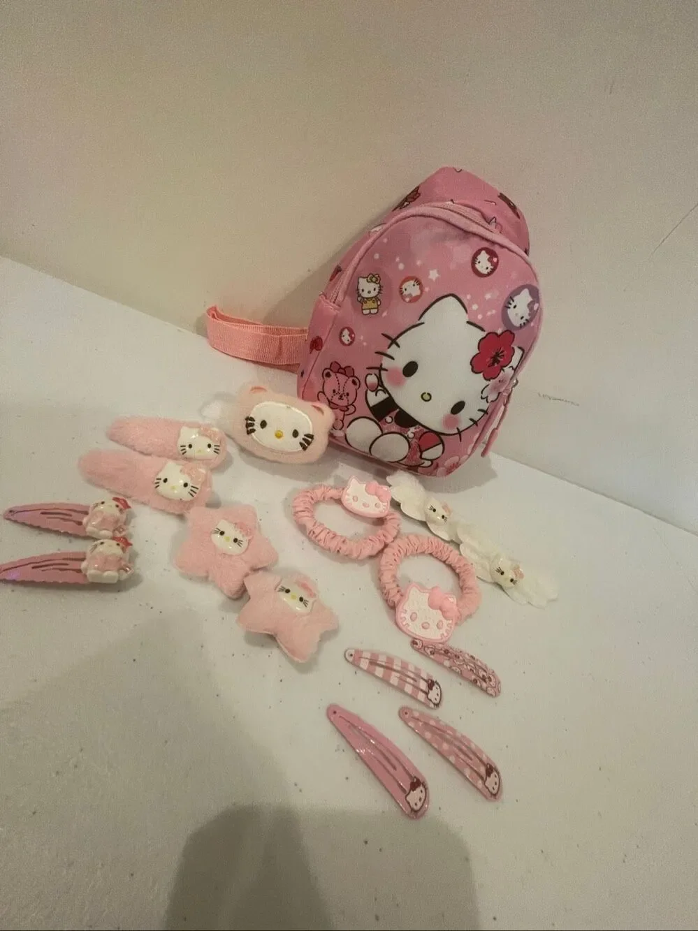 Hello Kitty mini back pack with 15 barrettes, hair clips and hair ties sticking